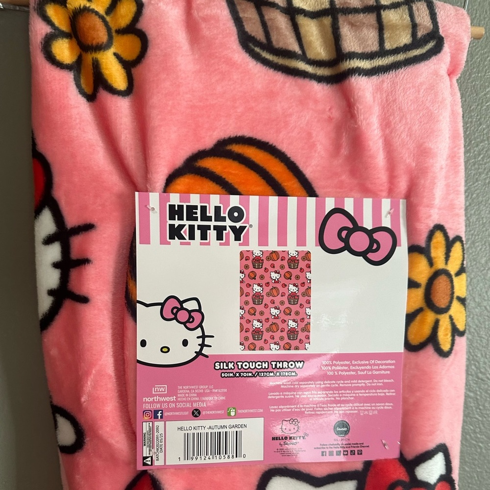 Hello Kitty fall blanket with pumpkins and basket of apples
